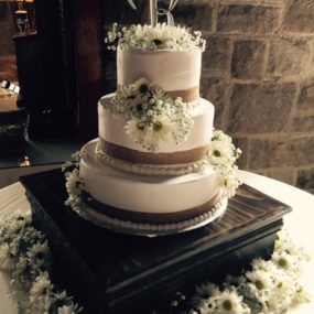 wedding cake green and brown flowers