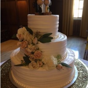 wedding cake with bride and groom on top
