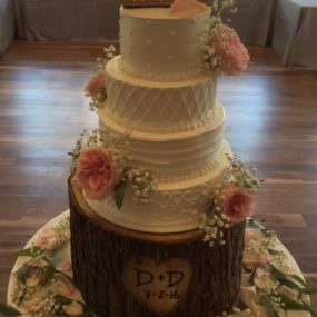 wedding cake with pink flowers