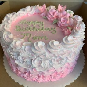 pink and white floral birthday cake